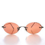 Load image into Gallery viewer, 90s Rimless Oval Copper Lens Sunglass
